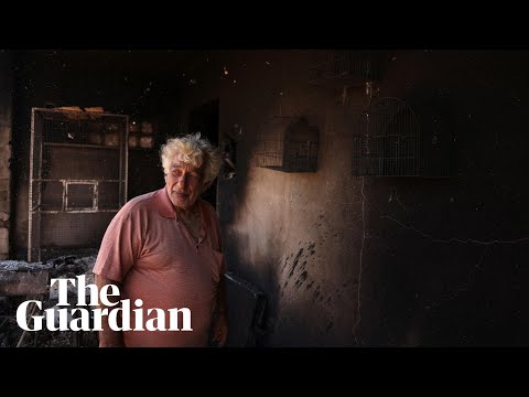 People in Greece return to homes burnt by wildfires