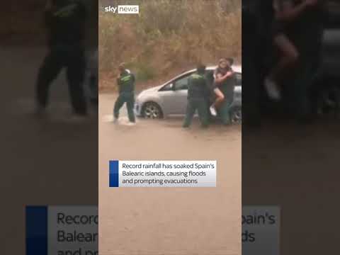 Family rescued from car in flood-hit Spain