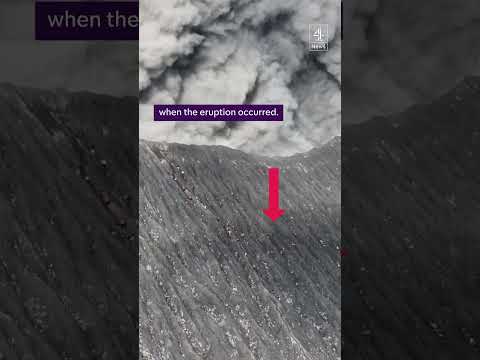 Climbers run from erupting volcano