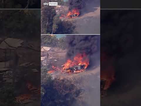 Firefighters battle brush fire as homes burn in California blaze