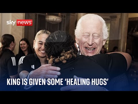 ‘A hug? Why not!’: King Charles swarmed by New Zealand women’s rugby team