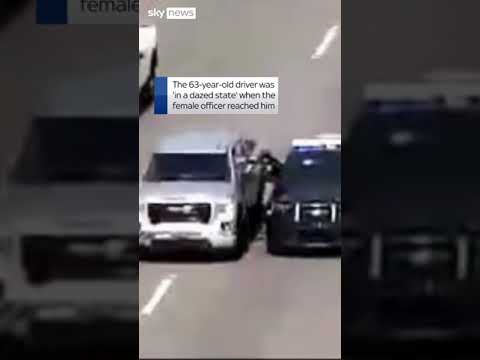 Police climb through window to rescue driver