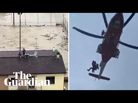 People rescued from rooftops as flooding hits northern Italy