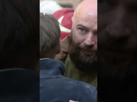 Lviv father comforted after losing family
