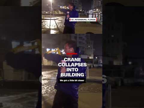 Crane collapses into building