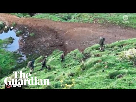 Footage appears to show Tom Phillips and his three children walking in rugged terrain