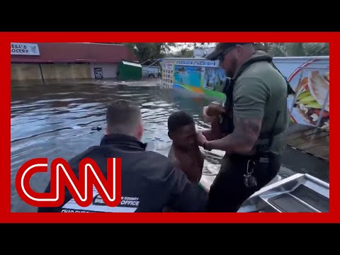 ‘He was waving us down’: Sheriff describes rescue of boy floating on a piece of fence