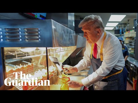 Donald Trump makes fries during staged campaign event at McDonald’s