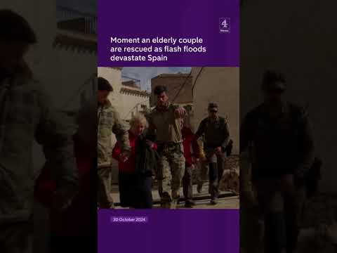Moment an elderly couple are rescued as flash floods devastate Spain