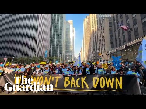 ‘We’re not leaving’: protests against Trump in New York and Washington DC