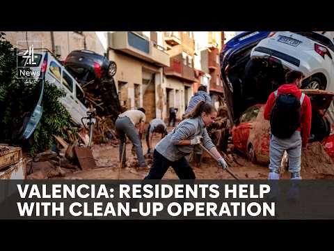 Spain floods: soldiers and army of volunteers work to clear wreckage