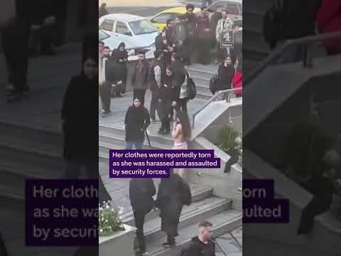 A female student strips to her underwear in protest at being assaulted by security forces in Iran