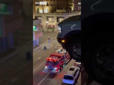 Car hangs from third floor of car park