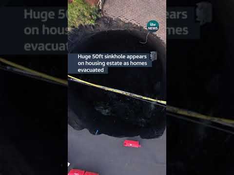 Huge 50ft sinkhole appears on housing estate as homes evacuated #itvnews #wales