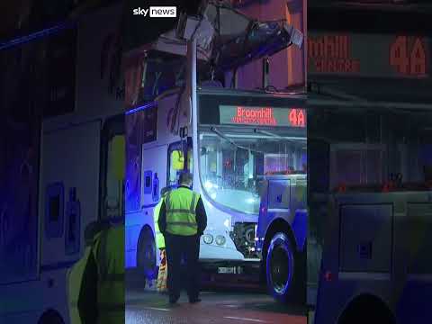 Double-decker bus crashes into bridge