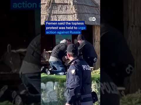 Topless anti-Russia activist tries to remove Jesus statue from baby crib | DW News
