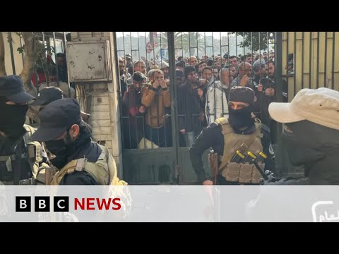 Assad’s soldiers give up their weapons in Syrian ‘reconciliation centres’ | BBC News