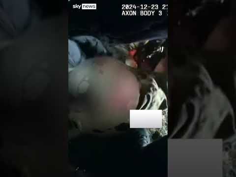 Moment driver pulled from burning car