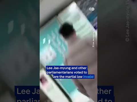 South Korea’s opposition leader Lee films himself jumping fence to enter National Assembly | DW News