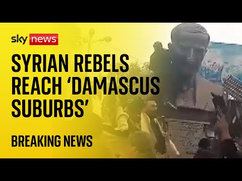 BREAKING: Syrian rebel forces ‘reach Damascus suburbs’ as protesters topple statue on outskirts