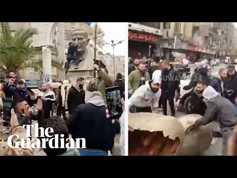 Footage shows protesters toppling statue of Bashar al-Assad’s father in Damascus suburb