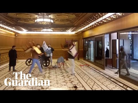 Syrian rebels carry furniture from presidential palace after ‘capturing’ Damascus