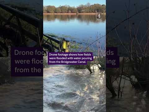 Heavy flooding collapses canal bank