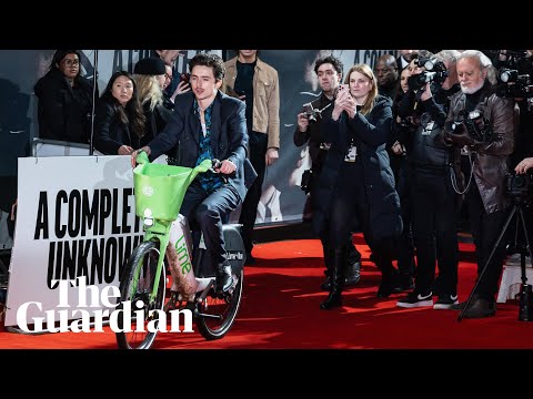 Timothée Chalamet arrives at London premiere of A Complete Unknown on Lime bike