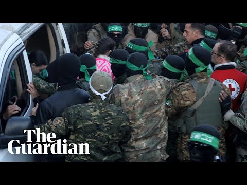 Hamas fighters hand over Israeli hostages after ceasefire takes effect