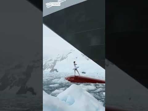 Ballerina dances on top of ship’s bow