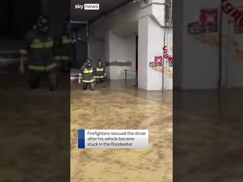 Driver rescued from floods in Italy