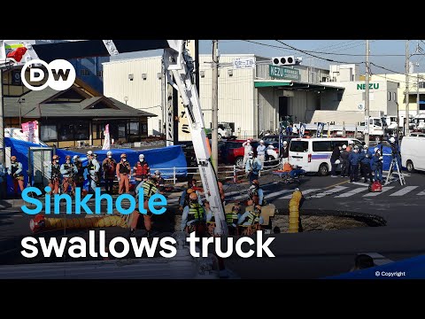 Search underway for Japanese man after truck falls into sinkhole | DW News