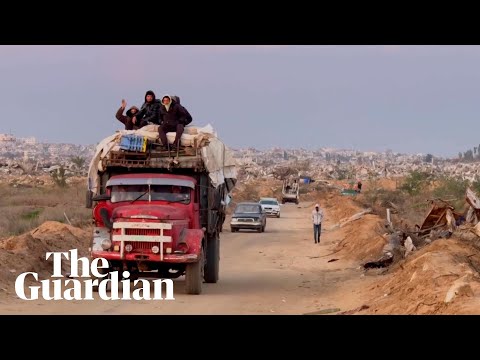 Palestinians travel through the Netzarim corridor after Israeli military withdraws