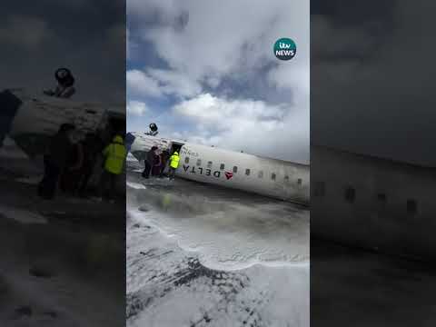 Passengers climb out of upturned plane after crash-landing in Toronto  #itvnews