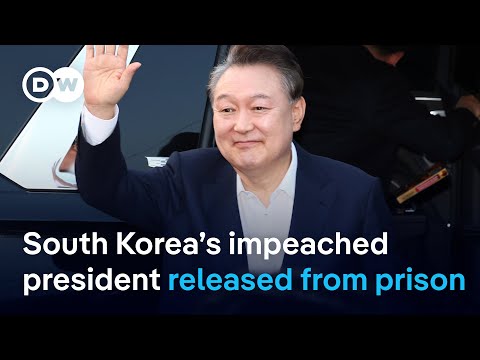 South Korea’s impeached President Yoon freed from prison but faces ongoing trials | DW News