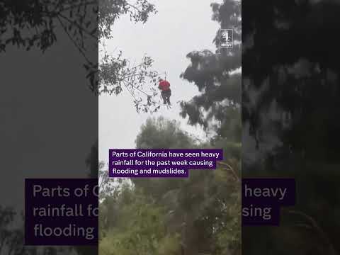 Dramatic moment a man was rescued by helicopter from raging floodwaters in California