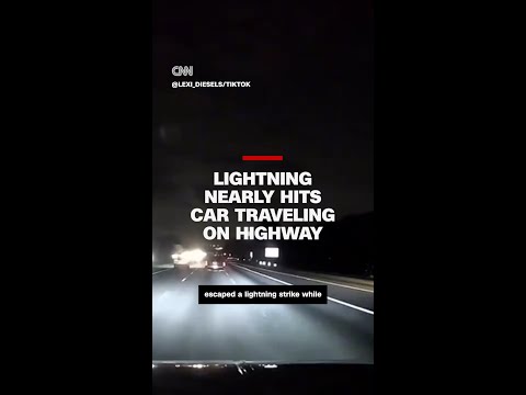 Lightning nearly hits car traveling on highway