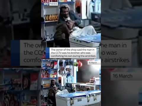 Father comforts distressed son during a reported US airstrike in Yemen
