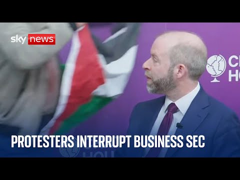 Business secretary interrupted by protesters at trade conference