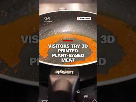 Visitors try 3D printed plant-based meat