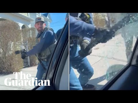 US immigration officers smash car window to detain man