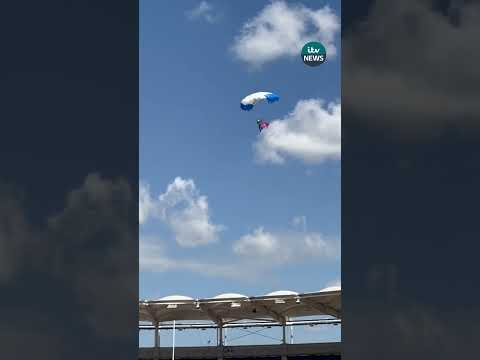 Rugby match delayed in France after parachutist left hanging from roof #itvnews