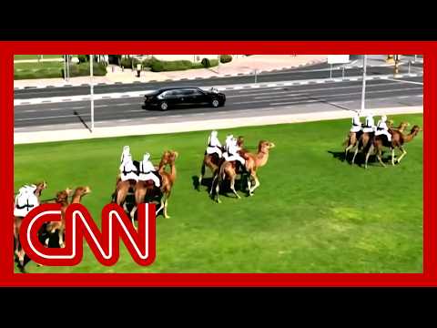 Trump welcomed to Qatar with red Cybertrucks and mounted camels