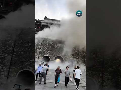 Moment tiles from centuries-old Chinese tower fall from roof | ITV News