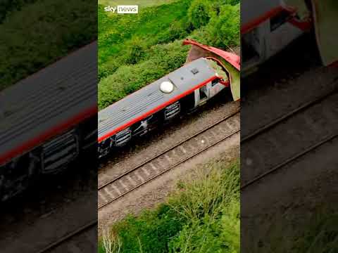 Train hits tractor trailer as arrest made