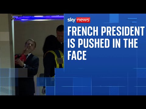 President Macron’s wife appears to push him in the face