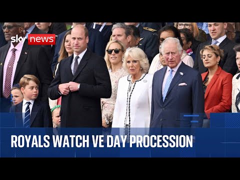 The Royal Family watch VE Day military procession