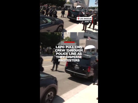 LAPD pull CNN crew through police line as they disperse protesters