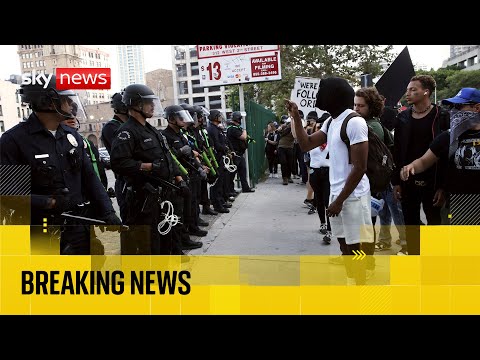 LA riot police set to enforce curfew as protests spread across US