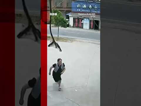 Girl rescues sister from runaway vehicle in China | BBC News